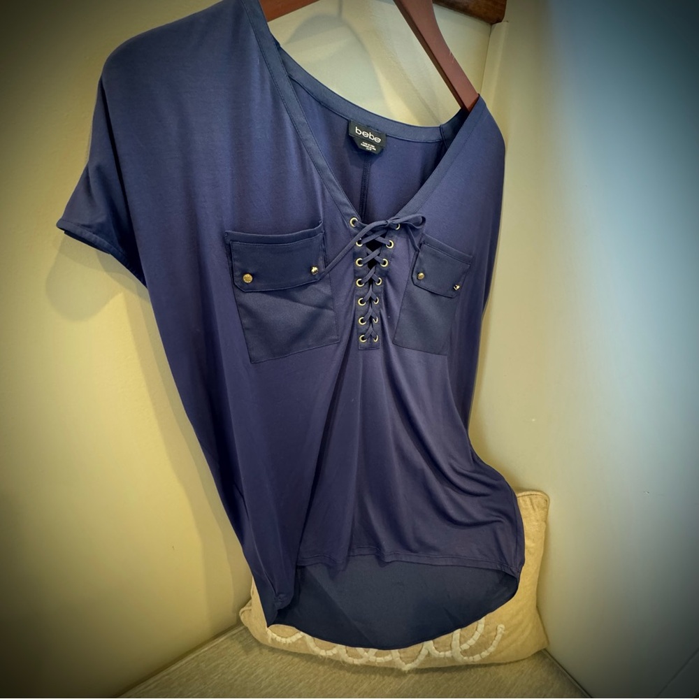 NWOT Bebe, blue blouse with beautiful details.